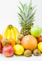 still life from different fruit on a white background