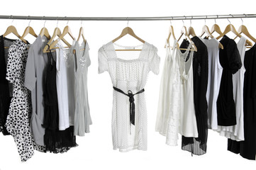 Set of fashion female clothing hanging on hangers