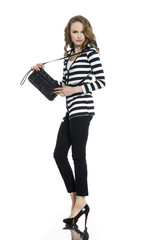 Full body Pretty young woman in stripy shirt with bag posing