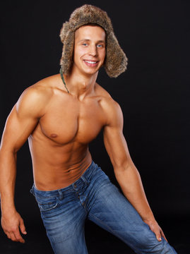 Hot man in ear-flaps hat
