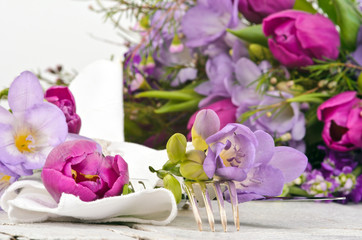 Romantic place setting with tulips and freesia for lovers