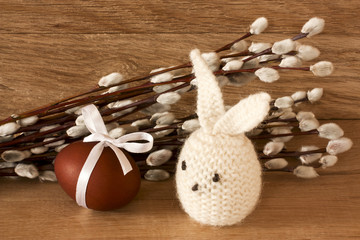 Easter egg and rabbit on catkins background