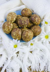 cakes on the white knitted fabric with a fringe and flowers of c