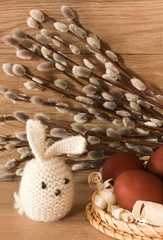 Easter eggs and rabbit on catkins background