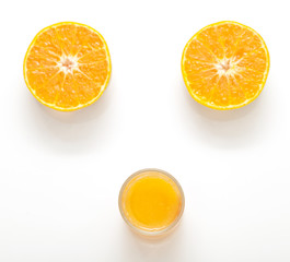 Orange juice and oranges isolated on white background