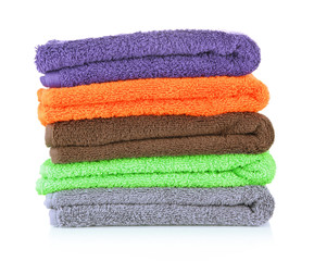 Pile of colorful towels, isolated on white