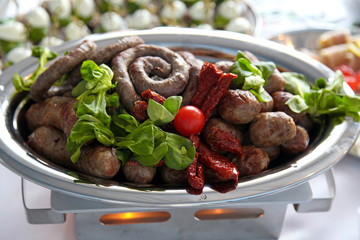 gourmet roasted sausages with tomatoes cherry