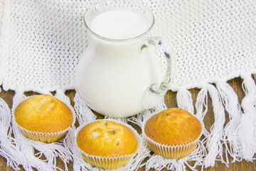 sweet vanilla domestic cakes and carafe with milk