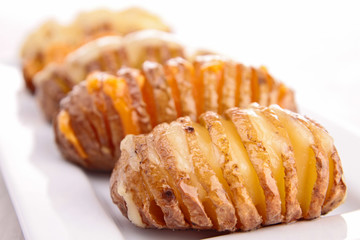 sliced baked potato with cheese