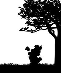 Easter bunny holding flower in the park silhouette