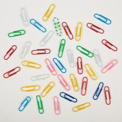 Paper clips on a white background. Closeup
