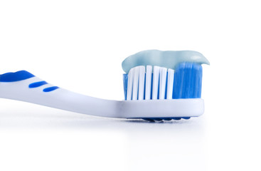 Tooth brush with tooth paste on white background