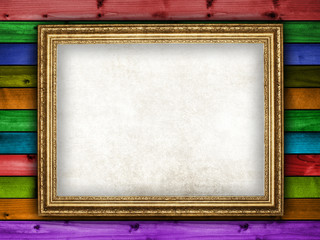 Blank paper sheet in picture frame on colorful planks background