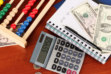 Bright wooden abacus and calculator. Conceptual photo of old