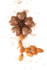 Chocolate hearts, almonds isolated on white