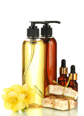 Liquid and hand-made soaps isolated on white