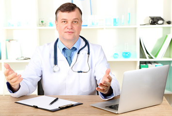 Medical doctor working at desk