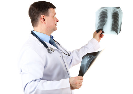 Medical doctor analysing x-ray image  isolated on white