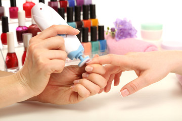 Manicure process in beauty salon, close up