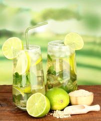 Glasses of cocktail with lime and mint
