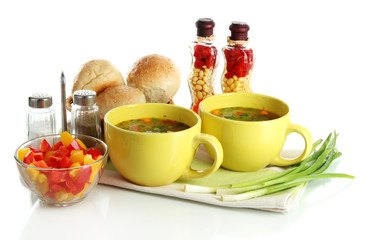 Fragrant soup in cups isolated on white