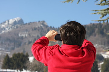 boy in red sweater that he photographed the Summit of a mountain