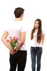 Fototapeta na wymiar Loving couple with tulips isolated on white