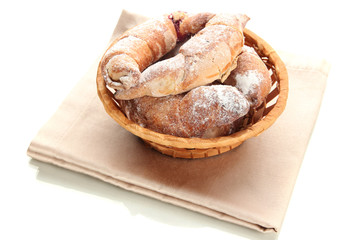 Taste croissants in basket isolated on white.