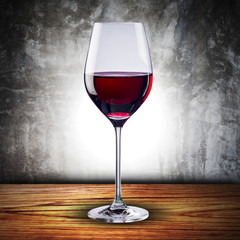 Glass of red wine on wood table