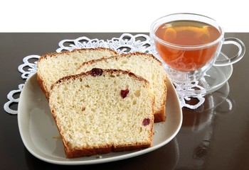 homemade sweet bun and cup of tea