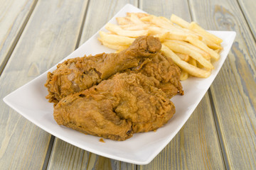Fried Chicken & Chips - Fried floured chicken & fries.