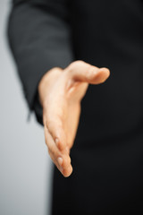 man in suit with an open hand