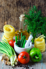 Mixture of spices, pasta , tomatoes and greens