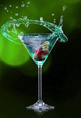 Martini drink over dark background