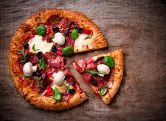 Delicious italian pizza served on wooden table
