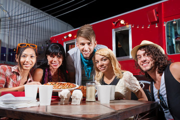 Friends Smiling Near Food Truck