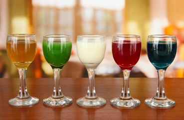 Tasty color liquors, on bright background