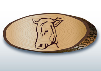 Elips şeklinde kesilmiş  ağaç üzerinde  tosun  başı