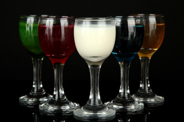 Tasty color liquors, isolated on black