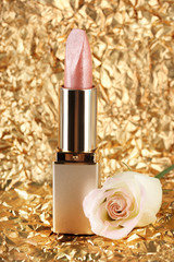 Beautiful lipstick on golden background