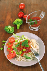 Tasty spaghetti with sauce and vegetables