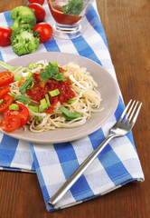 Tasty spaghetti with sauce and vegetables