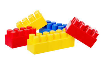 Multi-coloured Plastic building blocks, it is isolated on white