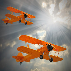 Old biplanes on the sky.