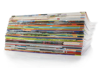 A large stack of magazines. On a white background with shadow.