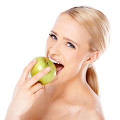 Beautiful girl is biting fresh apple