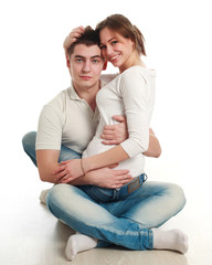 Fototapeta na wymiar Young couple In love, on a white background, in studio