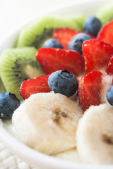 yogurt with banana, kiwi and berries