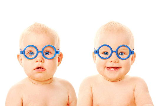 Two twins babies boys wearing glasses.