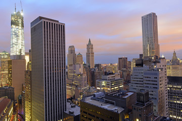 Fototapeta na wymiar Sunset over a dark Manhattan